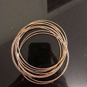 Gold Stack of Bracelets ( they are all connected)